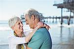 Senior couple hugging on beach