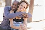 Smiling women hugging outdoors