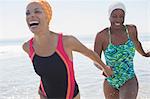 Enthusiastic lesbian couple at beach