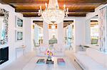 Illuminated chandelier over luxury living room