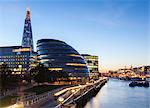 London skyline at dusk including the GLA building, HMS Belfast and the Shard, taken from Tower Bridge, London, England, United Kingdom, Europe