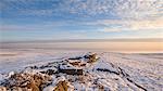 Glorious early morning light bathes the boulders and snow covered moor of Pockstones, with mist clearing in the Washburn Valley, North Yorkshire, Yorkshire, England, United Kingdom, Europe