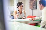 Young businesswoman meeting client in office