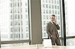 Portrait of businessman in high rise office