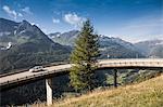 Car on elevated highway to Gotthard Pass, Switzerland