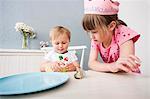 Baby boy playing with cupcake