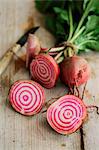 Halved beetroot on a wooden surface