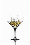 A martini splashing out of a glass