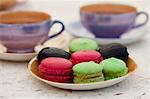 Colourful macaroons on a side plate