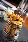 Deep-fried breaded sprats in a deep-frying basket