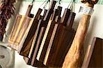 Chopping boards hanging up in a kitchen