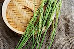 A steamer basket with ears of rice