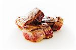 Seared Lamb Cubes on a White Background