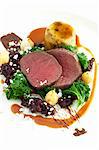 Medallions of venison with kale and cranberries