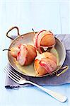 Pears wrapped in bacon, stuffed with Gorgonzola