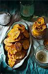 Potato crisps with a carrot and coriander dip