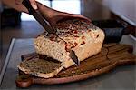 Freshly baked bread being cut