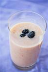 Peach milkshake with blackberries