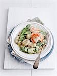 Saffron gnocchi with sugar snap peas and prawns