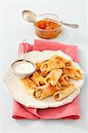 Mini apple turnovers with icing sugar and jam