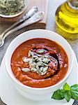 Pumpkin-tomato cream soup served with pumpkin seeds oil and pumpkin seeds.