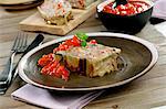 Meatloaf wrapped in aubergine with tomato sauce