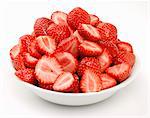 Whole and halved strawberries in a bowl