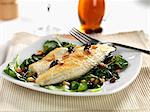 pan fried sea bass with wilted spinach, roasted pine nuts and sultanas