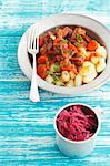 Beef braised in ale, with gnocchi and red cabbage