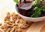 A Bowl of Mixed Greens and Walnuts