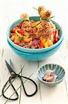 Chicken legs with sesame seeds, peppers and pineapple