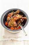 Chicken legs braised in wine, with carrots and thyme