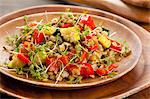 Lentil salad with grilled peppers, courgette and cress