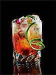 Singapore Sling cocktail with dragon fruit, lime, gin and cherry liqueur