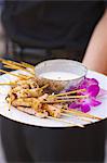 A Platter of Shrimp Skewers with a Yogurt Dip