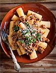 Rigatoni with minced meat sauce and herbs