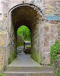 Passage through the old City Wall with the name Schnatterloch on sign, Miltenberg, Spessart, Franconia, Bavaria, Germany