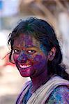 Indian woman celebrating annual Hindu Holi festival of colours with powder paints in Mumbai, formerly Bombay, Maharashtra, India