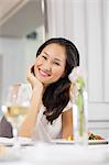 Beautiful smiling woman at meal table