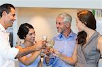 Business colleagues toasting champagne flutes