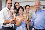 People holding champagne flutes