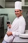 Chef relaxing with glass of red wine after work