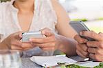 Couple on a date sending text messages