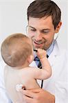 Pediatrician checking baby boy