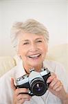 Senior woman taking a photograph