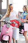 Two young women with scooter, Stockholm, Sweden