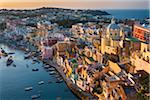 Overview of harbour at sunset, Corricella, Procida, Gulf of Naples, Campania, Italy.