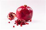 Whole pomegranate and pieces of pomegranate