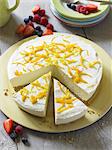 Cheesecake with lemon zest, partly sliced