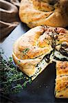 Round loaf with spinach filling and thyme